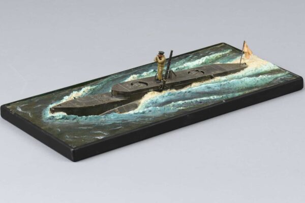 Todd also reproduced the subject of one his paintings into a three dimensional miniature model of a midget submarine half out of the water, creating wake as it speeds along the surface. National Museum of the Royal New Zealand Navy, 2007.46.1, Guy Todd, [date unknown] © CC BY 4.0.