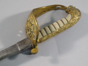 2012.15.1 ii Emilius Le Roy's sword is solid half-basket hilt design, he straight blade for the Le Roy sword is described as a Claymore.