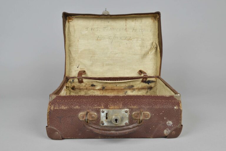2019.38.2 Small brown suitcase