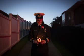 LT Samuel Fox stands in his driveway for Stand at Dawn ceremony, Anzac Day 2020, Standing Apart, Together As One.