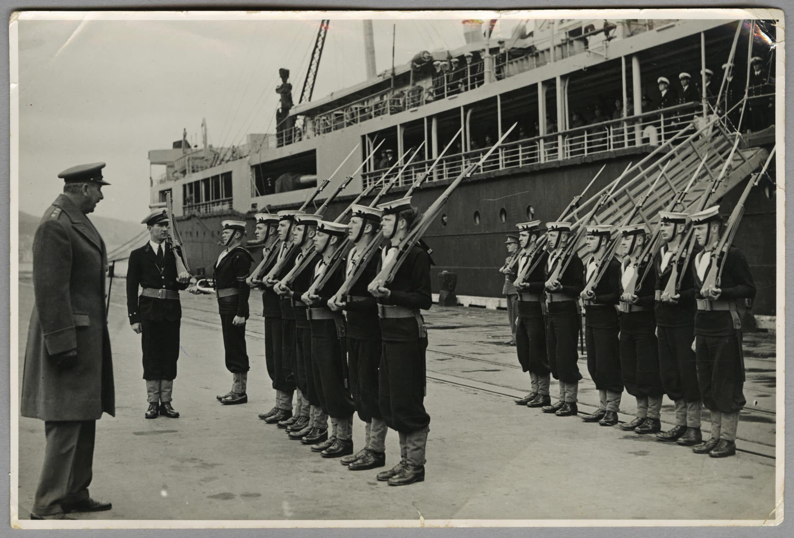 Sailors on the wharf in front of HMS Monowai 1941
