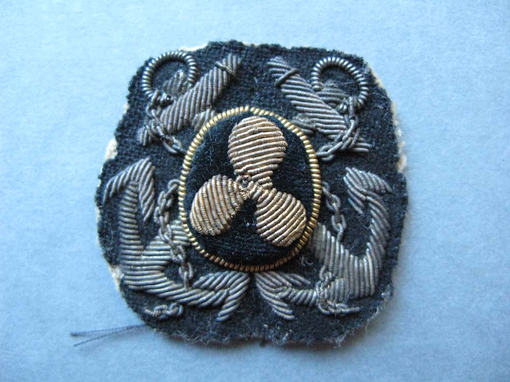 Hat badge of the Motor Boat Section of the Motor Transport Corps worn by C H T Palmer who co-ordinated the Hauraki Gulf motor boat patrols in the early days of WWI