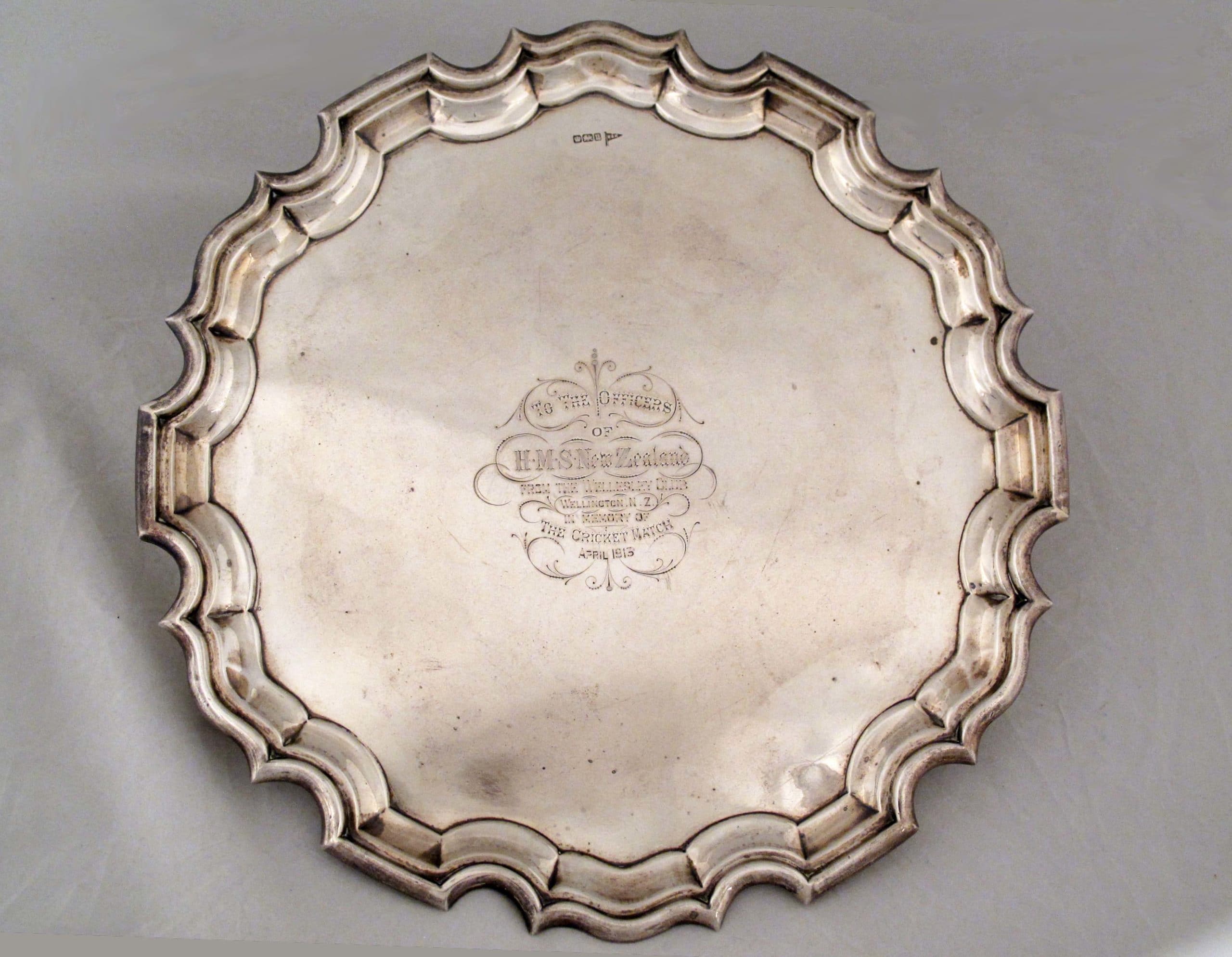 Silver salver with scalloped and turned up edges presented to HMS New Zealand.