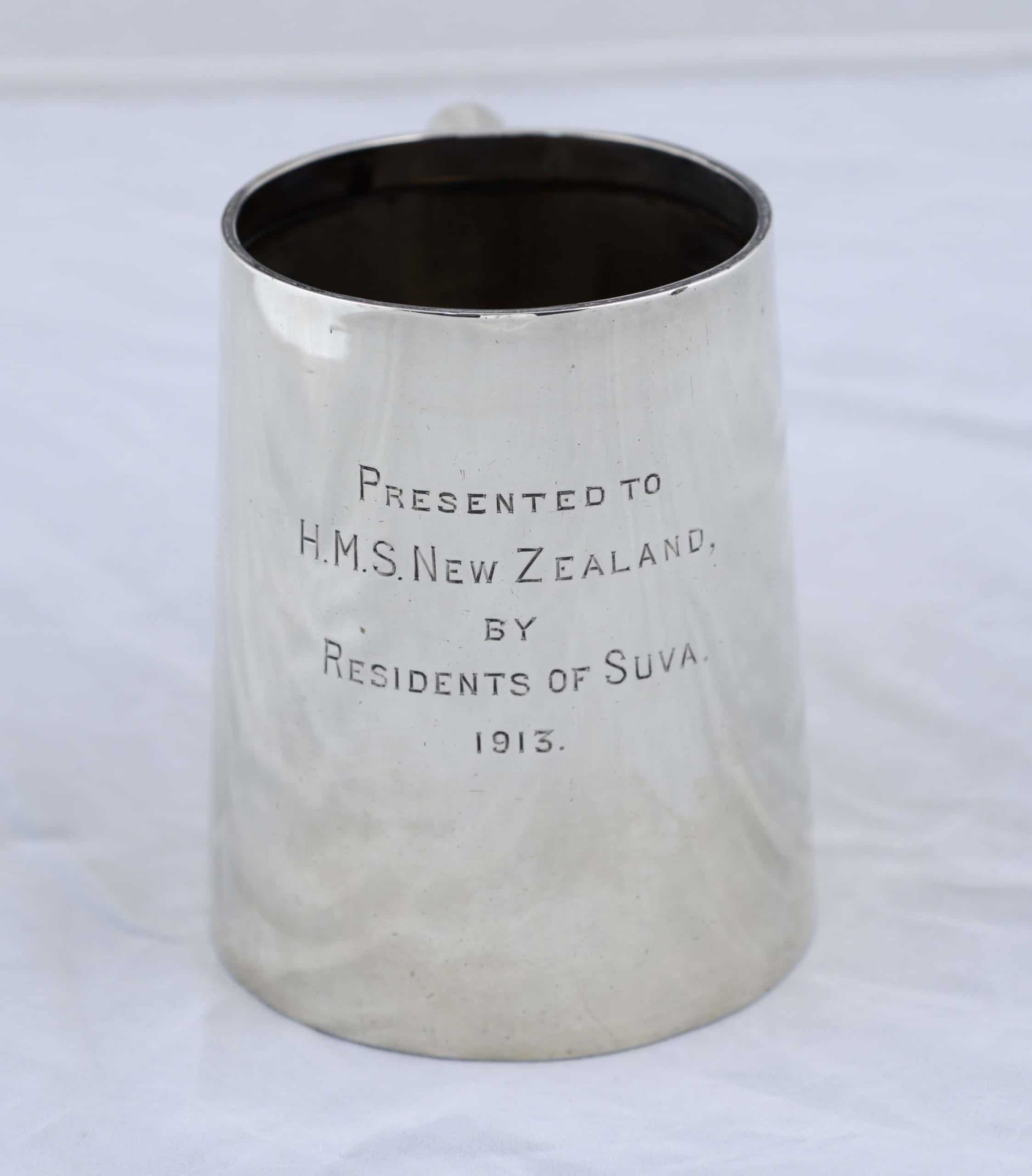 Silver tankard with handle presented to HMS New Zealand.