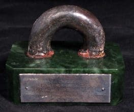 Mounted piece of ring bolt from HMS Queen Mary which landed on the quarterdeck of HMS New Zealand during the Battle of Jutland