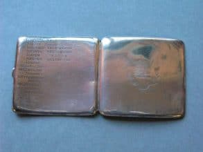 Silver cigarette case belonging to A D Boyle and engraved on back with all the ships he served in 1907-1921