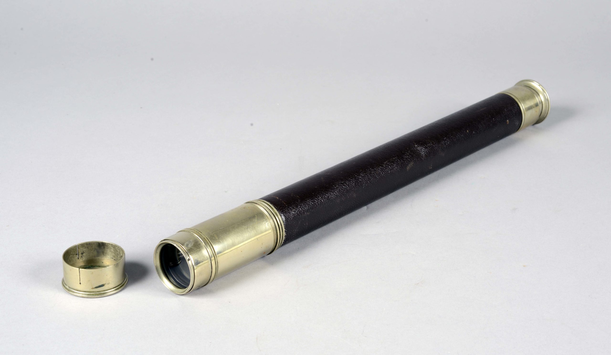 Telescope with leather bound body belonging to Lieutenant Bruce. Engraved on the sliding bar are the words: ‘D.F.F. Bruce’. Lieutenant Bruce was the Navigation Officer on the Cable Ship Iris.